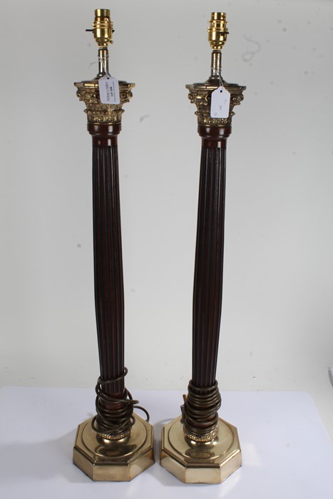 Pair of tall reeded mahogany and brass corinthian column capped column table lamps, on octagonal
