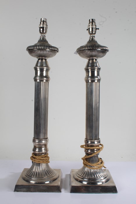 Pair of silver plated table lamps of reeded candlestick form, 60cm high, 16cm square at the bases