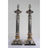 Pair of silver plated table lamps of reeded candlestick form, 60cm high, 16cm square at the bases
