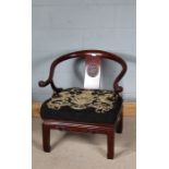 Pair of Chinese horseshoe back chairs, curved cresting rail terminating in out-swept scrolled arm