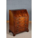 George III style mahogany bureau, the sloping fall enclosing a compartmentalised interior, fitted