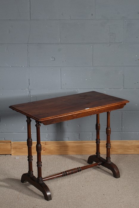 1930's nest of three walnut tables, with a carved floral design to the front, 58cm tall