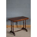 1930's nest of three walnut tables, with a carved floral design to the front, 58cm tall