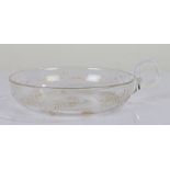 19th Century glass dish, of circular form, with a carrying handle, the dish with gilt floral