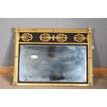 Gilded and black painted overmantel mirror with stylised gilt leaf frieze above reeded side columns,