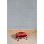 19th Century gout stool, upholstered in red velvet, raised on squat cabriole legs, 36.5cm x 32cm