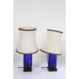 Pair of blue glass lamps, with black square bases, (2)