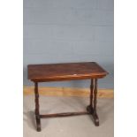 Late Victorian stretcher table, the oblong top raised on turned legs and united by a single