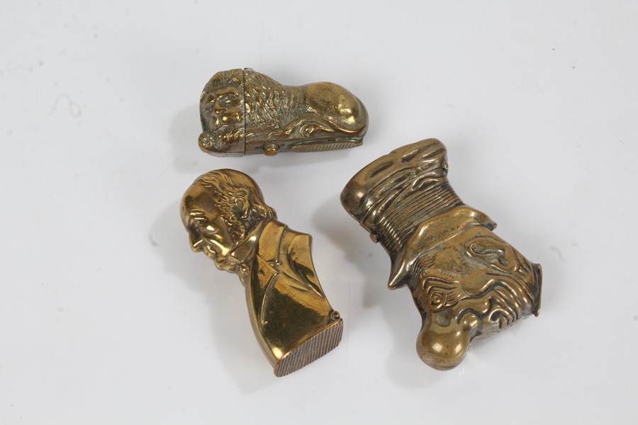 Brass vesta case in the form of a sleeping lion, brass vesta case depicting a Georgian gentleman