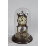 Glass domed clock, with an enamel dial and Roman hours