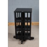 Late Victorian ebonised revolving bookcase, with slatted sides and raised on stand, 48cm x 96.5cm