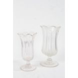 Two 19th Century glass vases, with bodies formed as tall leaves above the ring turned stem and wide,