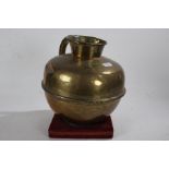 Large Eastern brass pot, of squat bulbous form, 28cm high