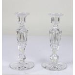 Pair of 20th Century glass candlesticks, the sconces raised on tapering stems, raised on star cut