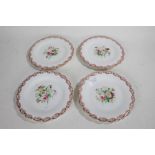 Four 19th Century porcelain plates, each with pink and gilt entwined foliate borders and centred