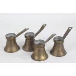 Four small Pakrac brass side pouring pots, each with side handles, tapering bodies with spouts and