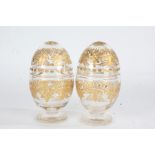 Pair of 19th Century glass preserve pots, each of ovoid form with lift up lids, having overlaid gilt