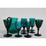 Eight various 19th Century green wine glasses, together with a green glass jug (9)