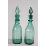 Pair of 19th Century green glass decanters, each with pointed stoppers, 35cm high (2)