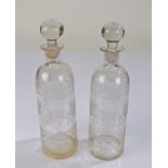 Pair of 19th Century glass decanters, each with bulbous stoppers and having tapering bodies etched