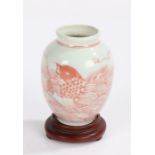 Chinese miniature porcelain vase, the body decorated with carp amongst stylised waves, on a hardwood
