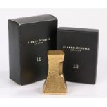 Dunhill London "Wheatsheaf" table lighter, the gold plated tapering body with beaten decoration, 7cm