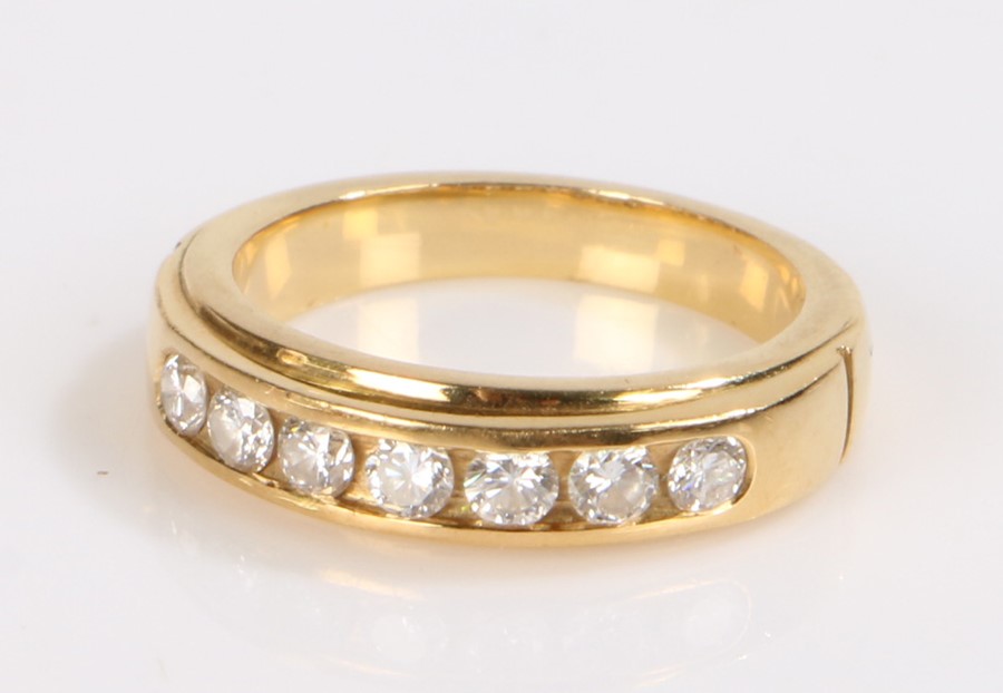 Diamond set ring, the ring with a row of seven round cut diamonds totalling 0.54 carat, set to a