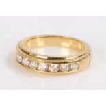 Diamond set ring, the ring with a row of seven round cut diamonds totalling 0.54 carat, set to a
