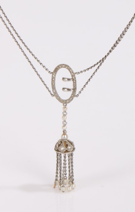Early 20th Century diamond and pearl necklace, with twin chains to the buckle and tassel drop