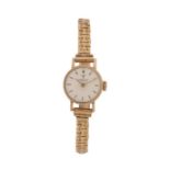 Tissot 9 carat gold cased ladies wristwatch, the signed white dial with baton markers, manual wound,