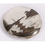Oriental inspired silver powder compact, the cover decorated with an Oriental landscape scene, the