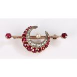 Diamond and ruby brooch, the crescent centre with an arched line of rubies and an arched line of