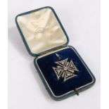 Edwardian diamond set Maltese cross brooch/pendant, with a central diamond surround by triangular