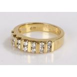 18 carat gold diamond set ring, with a dual row of round cut diamonds containing a total of fourteen