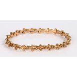 9 carat gold bracelet, with a patented X frame links, 16.4 grams