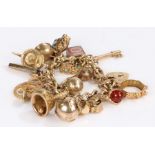 9 carat gold charm bracelet, with a collection of charms to include a bell, Masonic cross, turtle,
