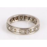 Diamond eternity ring, with nineteen diamonds to the white metal shank, ring size M