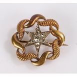 George III 14 carat gold diamond set brooch, the central diamond set star with a woven effect
