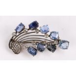 Edwardian costume brooch, with blue and clear stones to form a floral spray, 47mm long
