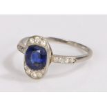 Art Deco sapphire and diamond set ring, the central oval sapphire with a diamond surround, further