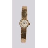 Omega ladies 9 carat gold wristwatch, the signed silvered dial with 9 carat gold Omega strap, the
