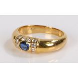 18 carat gold sapphire and diamond set ring, with a central sapphire and a twelve diamond