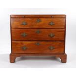 George III mahogany chest of drawers, the rectangular caddy top above a brushing slide and three
