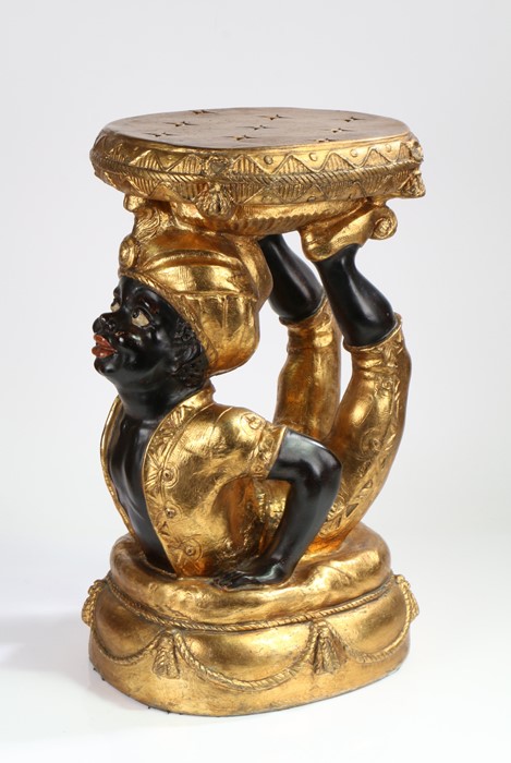 Blackamoor stool, the gilt top above the arched figure on a pillow effect base, 57cm high