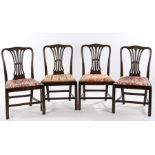 Set of four mahogany dining chairs, in the George III manner, with a prince of Wales feathers carved