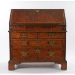 George II walnut bureau, the fall opening to reveal a black lined writing surface, well with sliding
