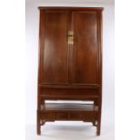 Chinese chestnut tapered cabinet on stand, Qing Dynasty, the moulded cornice above the pair of