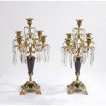 Pair of 19th Century continental ormolu and black marble four branch candelabra, each with five