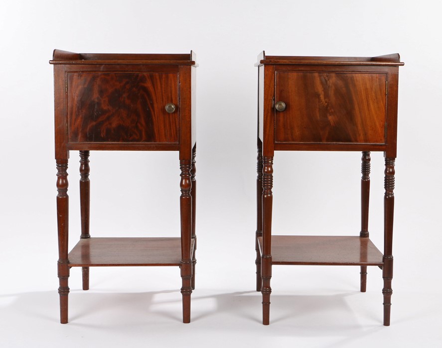 Near pair of Victorian mahogany pot/bedside cupboards, the gallery top above a single door enclosing