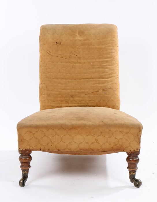 Victorian nursing chair, with upholstered back and seat, raised on turned front legs with brass